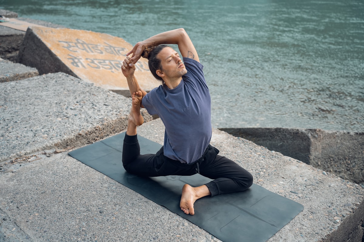 Man practicing yoga stretching pose